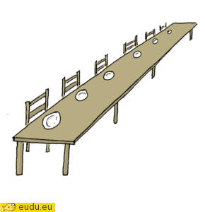 Een lange tafel waaraan zes stoelen naast elkaar passen.